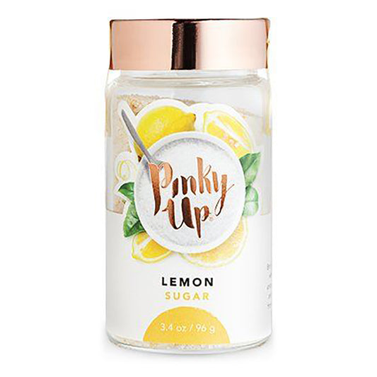 Jar of lemon sugar with a rose gold lid on a white background