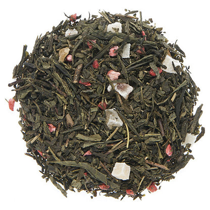 Green Tea leaves with visible petals and dry strawberry pieces on a white background