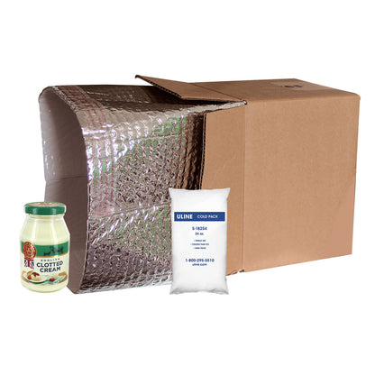 Cardboard box with bubble wrap, jar of Clotted Cream, and Uline cold pack on a white background