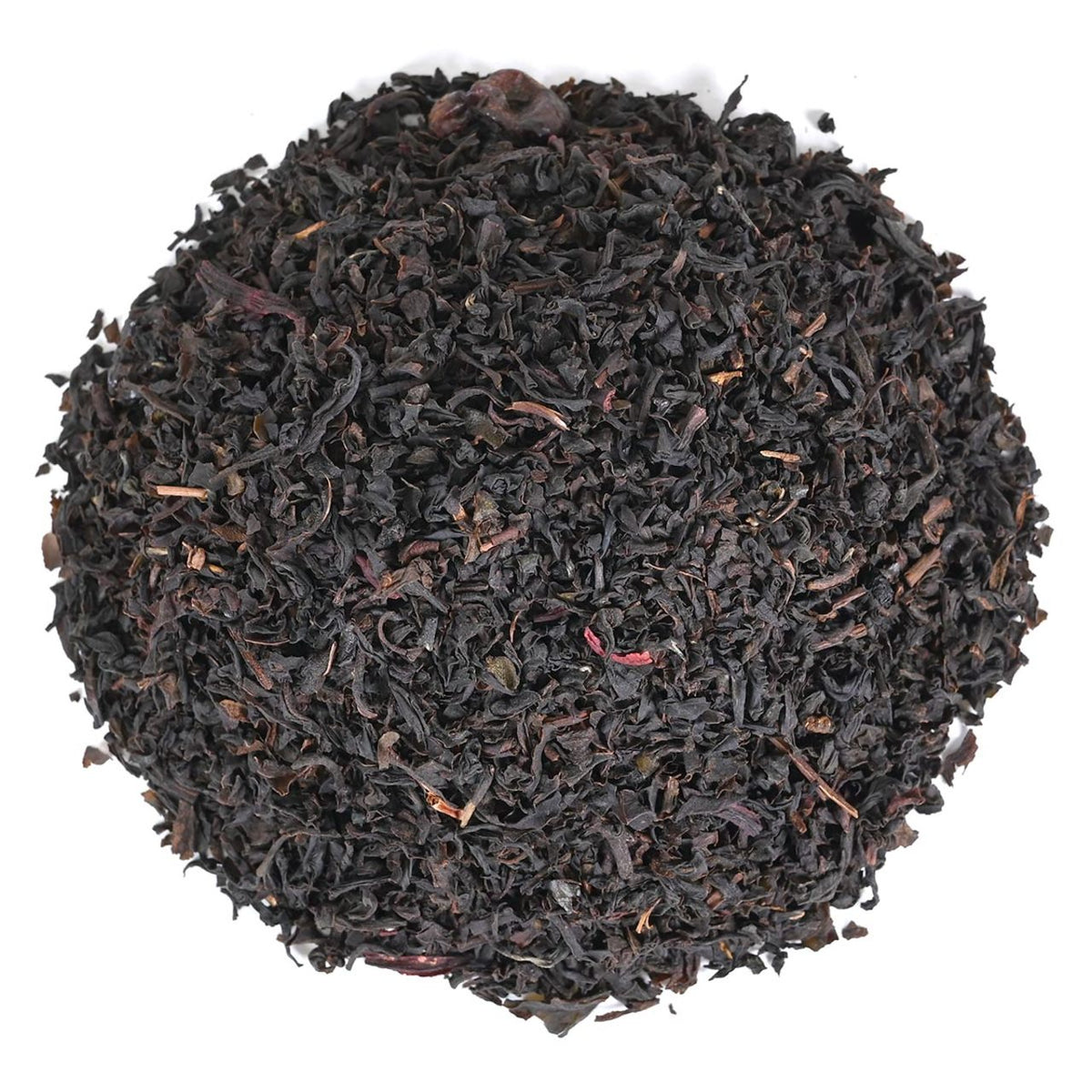 Close-up of black tea leaves on a white background