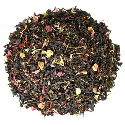 Pile of loose-leaf black tea leaves with pink and yellow flower petals mixed in.