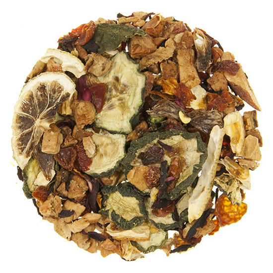 Assorted dried tea leaves including dry citrus pieces on a white background