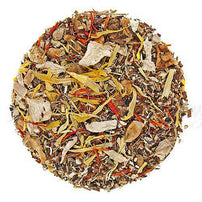 Dried tea leaves of yellow and brown leaves in a circle on a white background.
