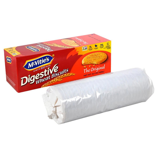 Box of McVitie's Digestive Wheat Biscuits and a stack of biscuits in a white wrapper next to the box on a white backgroung.