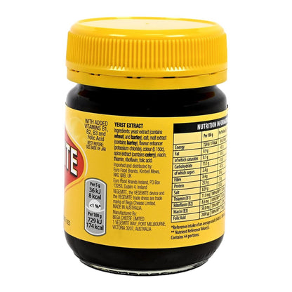 Yellow jar of Vegemite yeast extract with a yellow lid and label on a white background