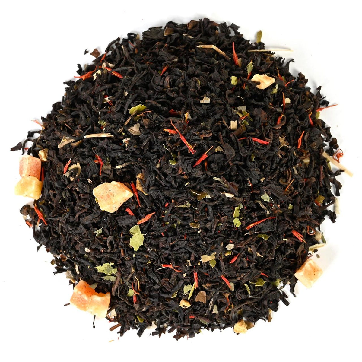 Top-down view of black loose-leaf tea mixed with orange pieces and green leaves on a white background.
