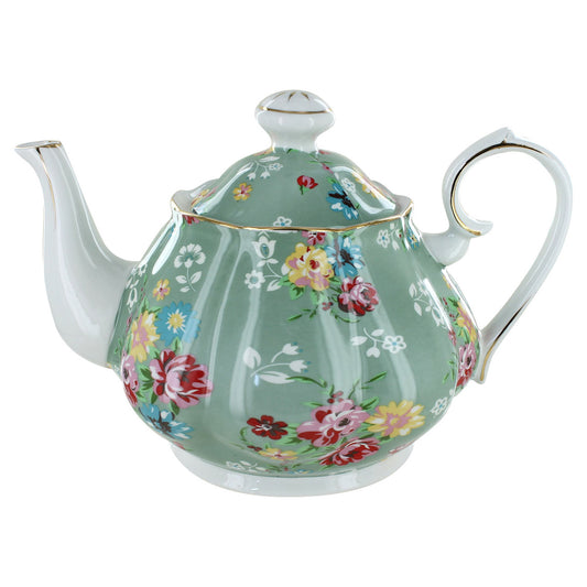 Porcelain teapot with floral design on a white background