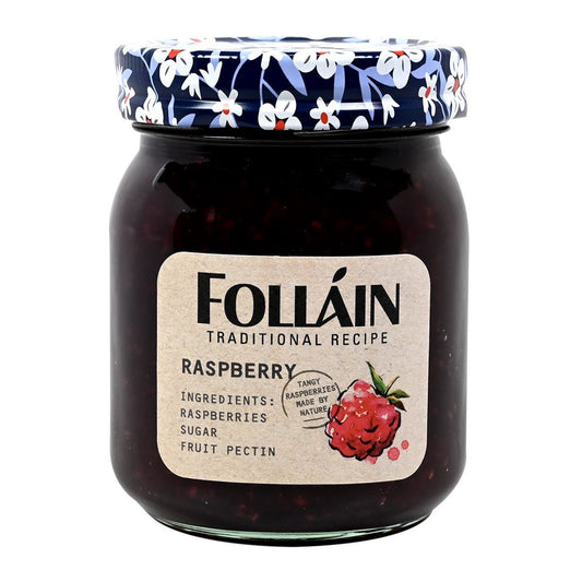 Jar of Folláin raspberry jam with floral lid on a white background