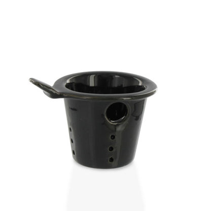 Black ceramic teapot infuser with drainage holes on a white background