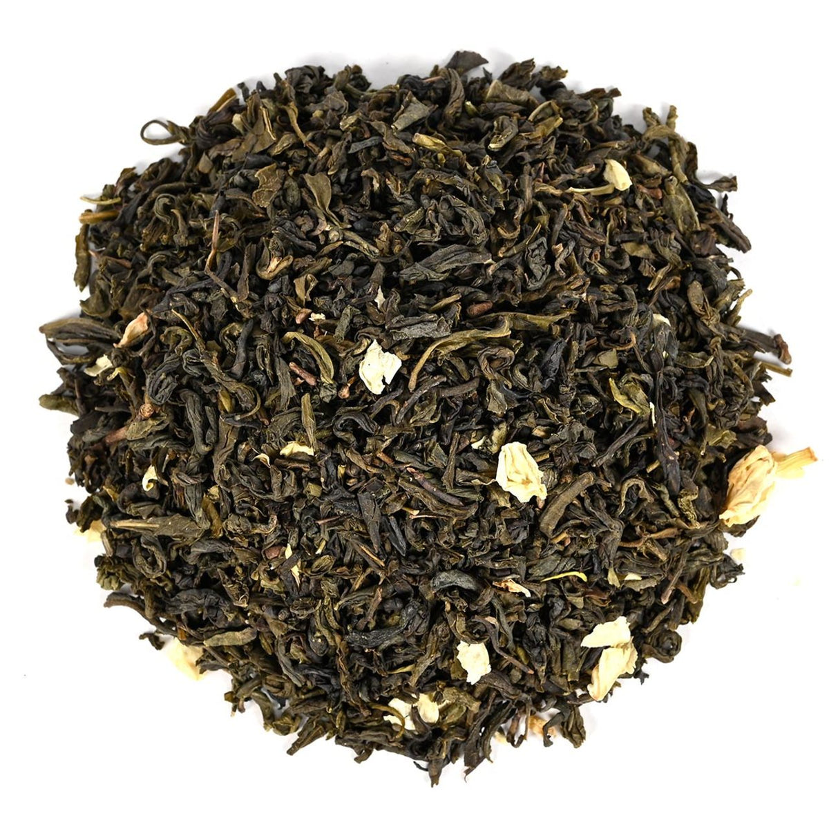 Close-up of dry black tea leaves on a white background