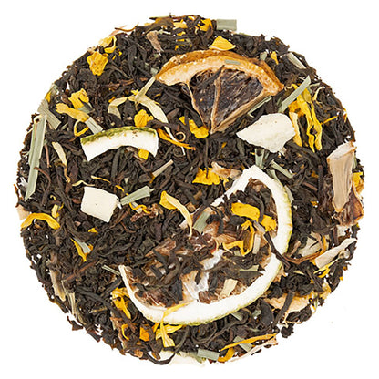 Tea ball with black tea leaves, dried citrus fruit pieces, and petals on a white background