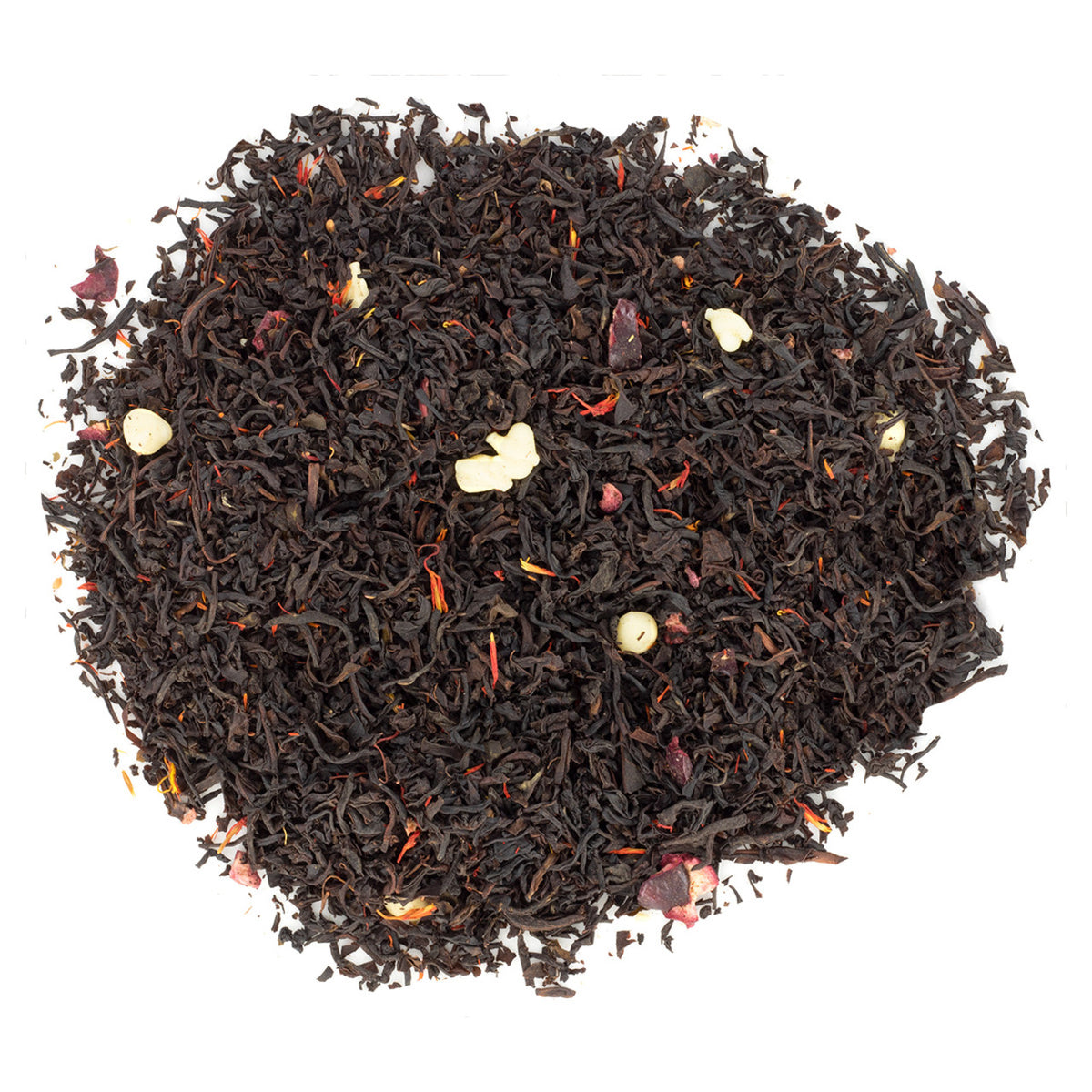 Loose leaf black tea with pieces of dried fruit and petals scattered throughout.