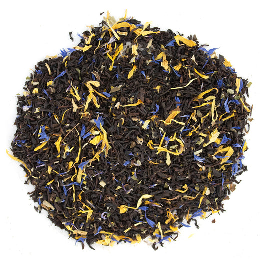 Tea leaves with yellow and blue flowers on a white background