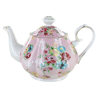 Floral teapot on a pink background