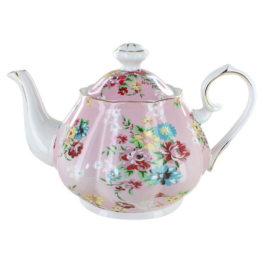 Floral teapot on a pink background