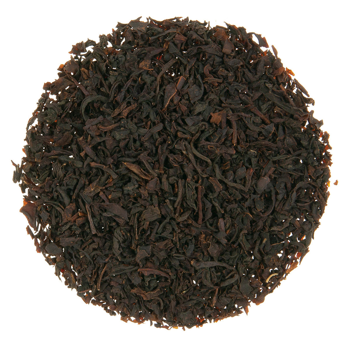Close-up of dark brown tea leaves on a white background