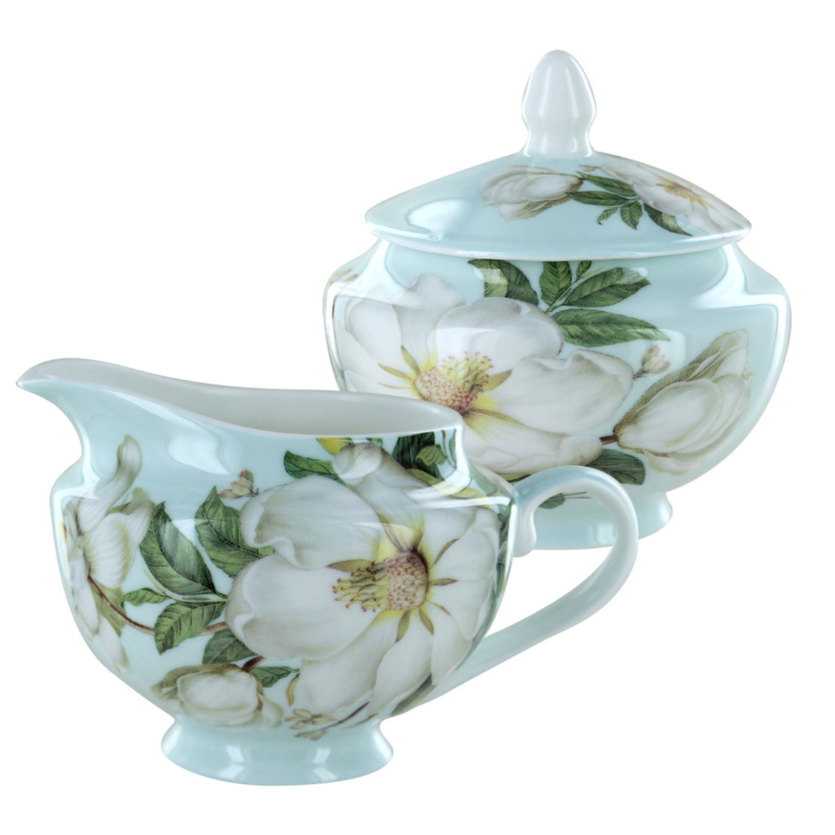 Teapot and sugar bowl with floral design on a white background
