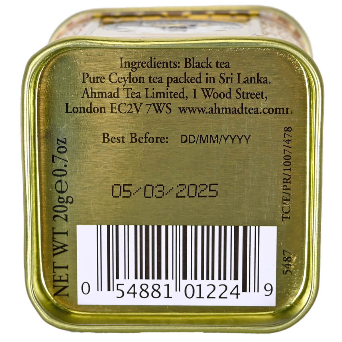 Gold tea tin with label displaying ingredients, best before date, and barcode.