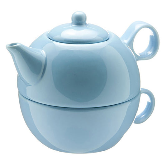 Light blue ceramic tea for one set with the teapot stacked on a teacup on a white background