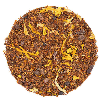 Round tea blend with visible leaves and flowers on a white background
