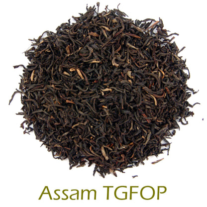 Assam TGFPOP black tea leaves on a white background