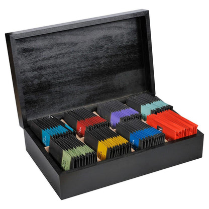 Black wooden tea chest box with colorful individually wrapped teabags inside