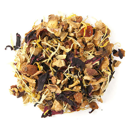 A pile of dried loose leaf herbal tea with visible pieces of apple, hibiscus, rosehip, orange, and calendula petals.