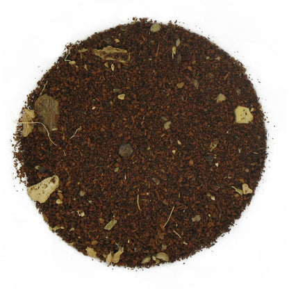 A close-up image of loose leaf decaf chai tea with visible spices integrated throughout.