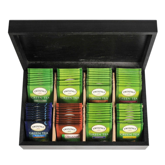 Collection of Twinings green tea packets in a black display box.