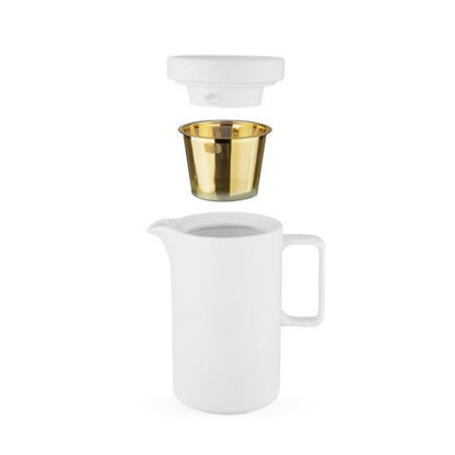 White pitcher with gold infuser and white lid on a white background