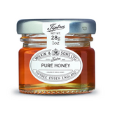 Jar of Tiptree pure honey on a white background