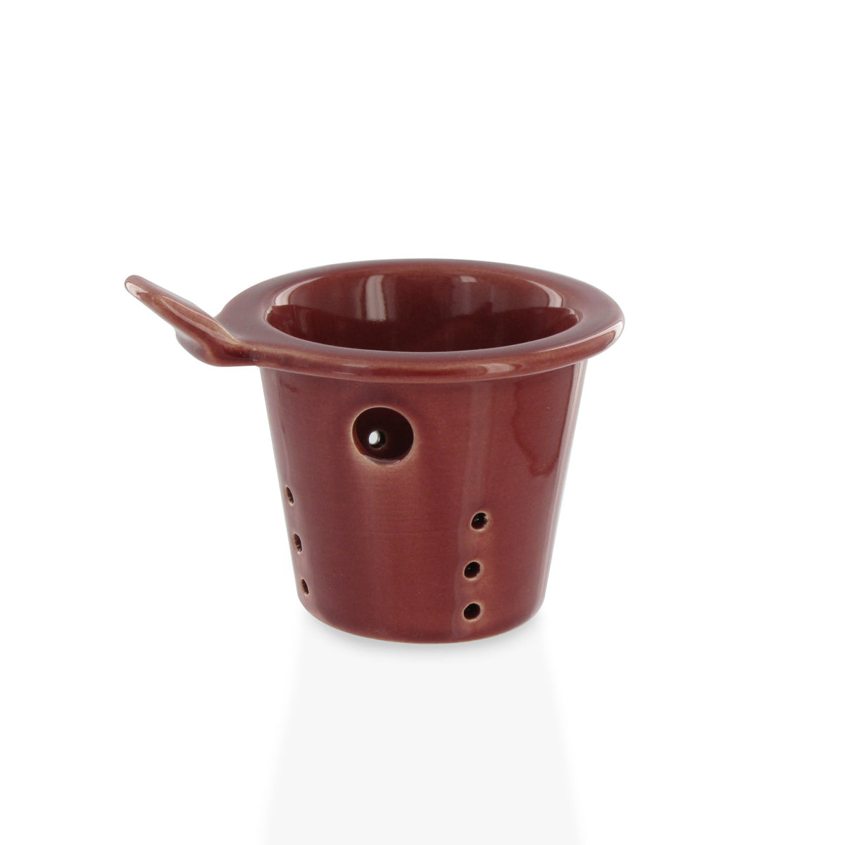 Burgundy ceramic teapot infuser on a white background