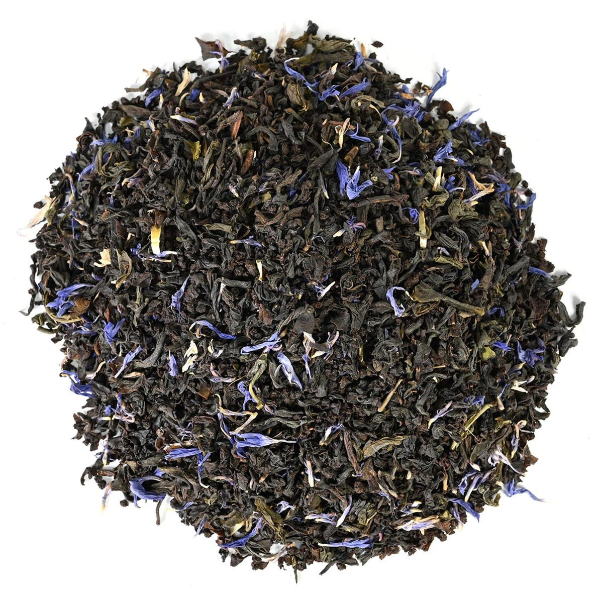 Dry black tea leaves with purple peddles in a circular pattern on a white backround.