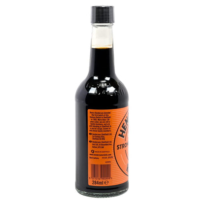 Bottle of Henderson's Strong Relish sauce on a white background