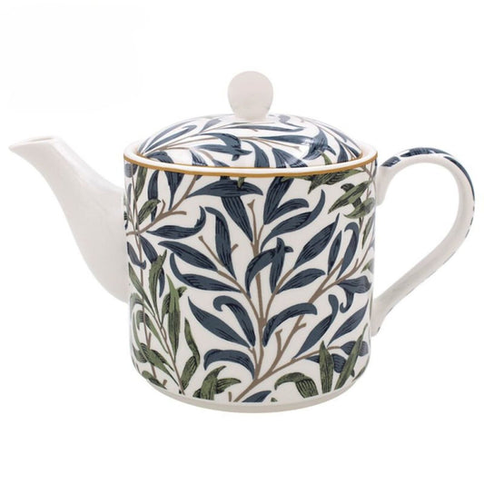 White teapot with blue and green leaf pattern on a white background