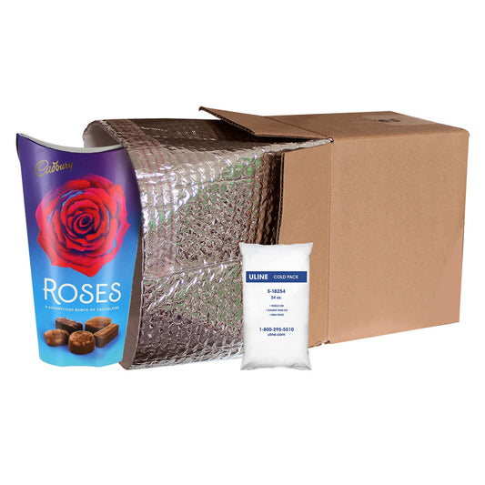 Cardboard box with insulation wrap, Cadbury Roses packaging, and Uline cold pack on a white background