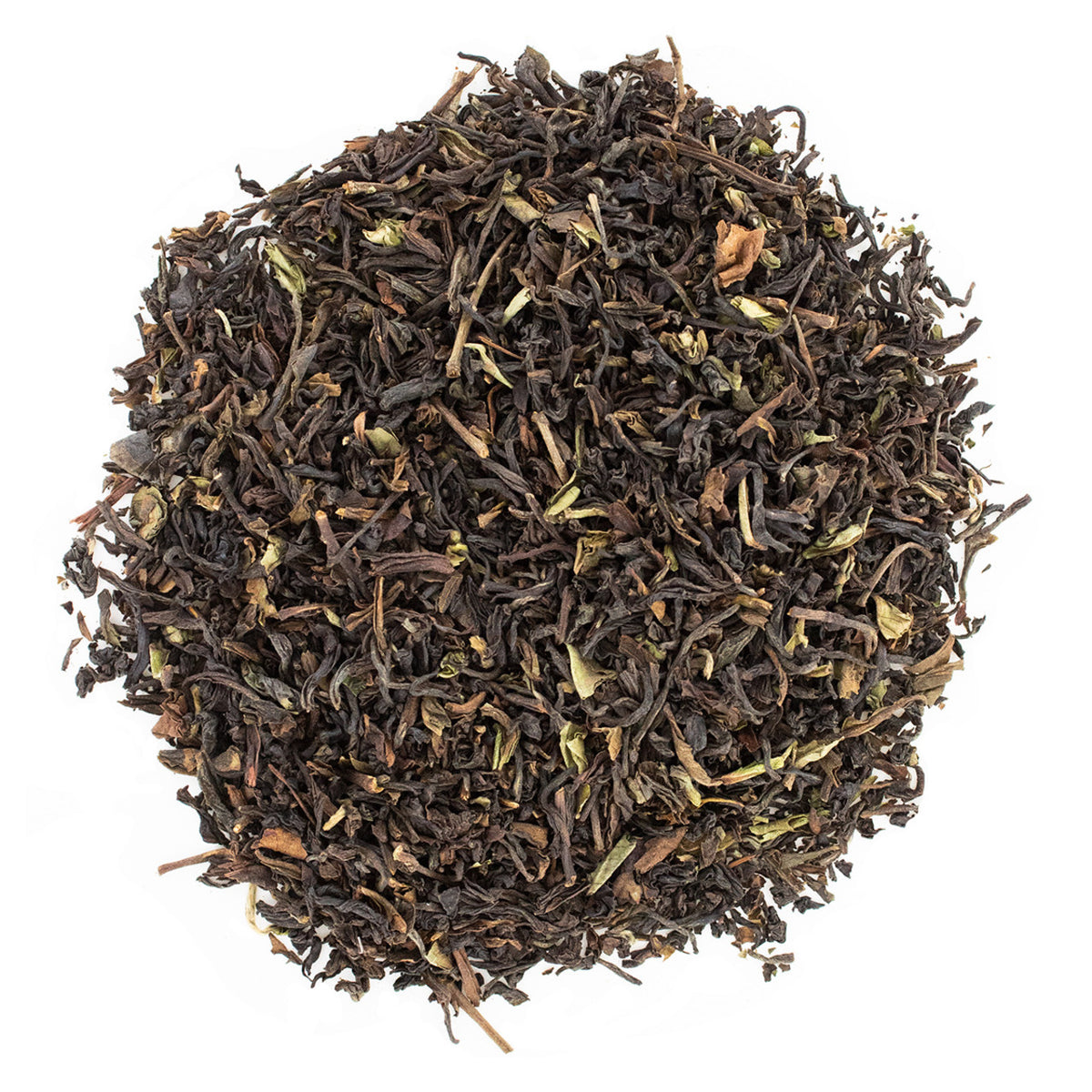 Close-up of dark brown dried tea leaves on a white background