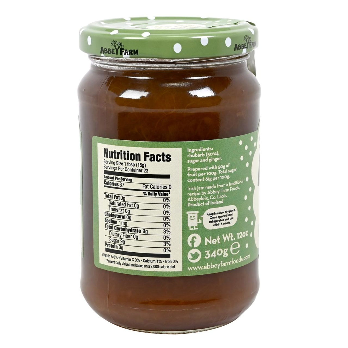 Jar of Abbey Farm Rhubarb & Ginger Preserve with green lid on a white background with label showing nutrition facts and ingredients