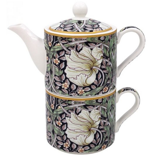 Decorative teapot with floral patterns on a white background
