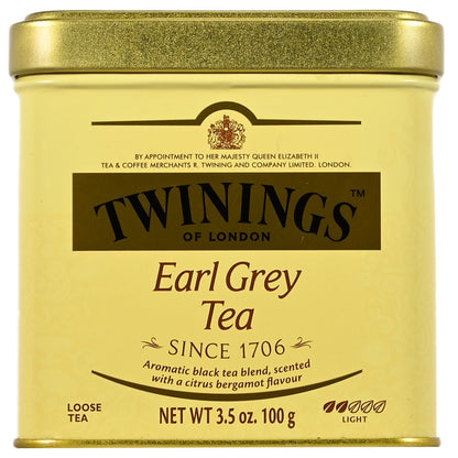 Twinings Earl Grey Tea canister with gold lid and yellow body.