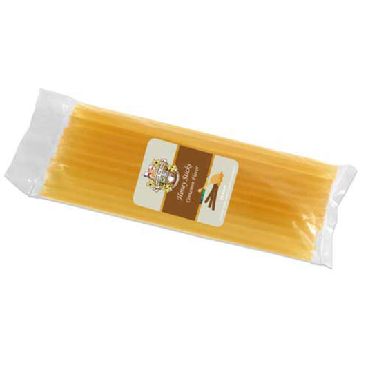 Packaged honey sticks with a label on a white background