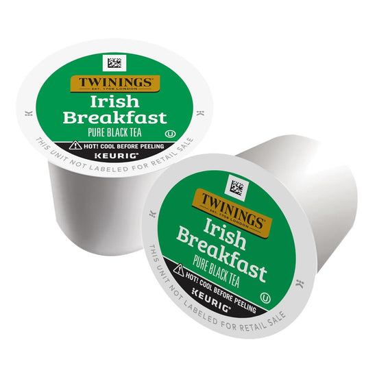 Two Twinings Irish Breakfast tea k-cup capsules on a white background