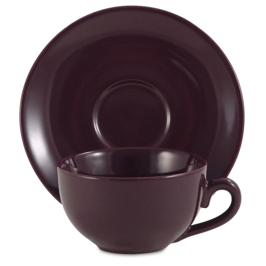 Plum ceramic cup and saucer set on a white background