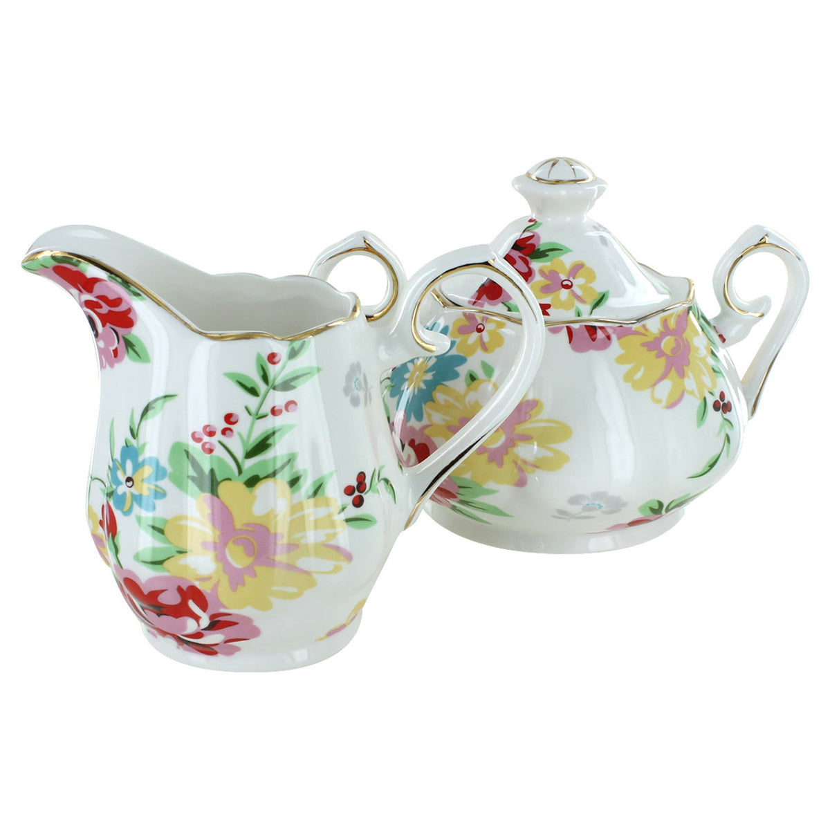 Floral-patterned teapot and milk jug set on a white background