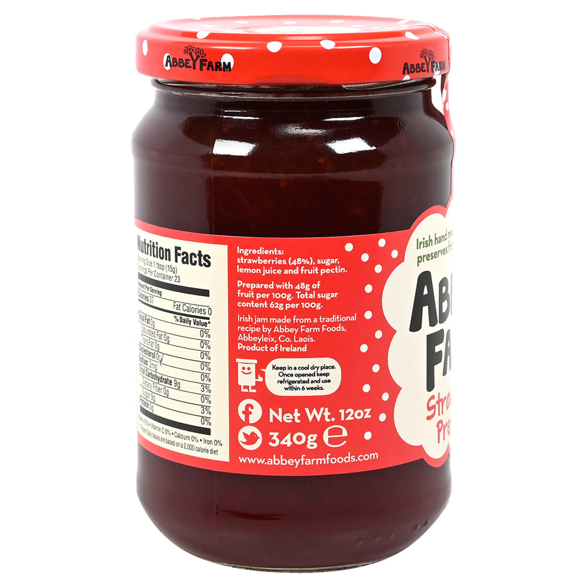 Jar of Abbey Farm Strawberry Preserve with a red lid on a white background.  Label shows nutrition information.