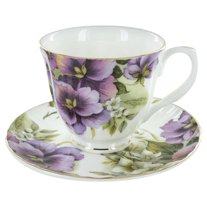 Teacup and saucer with floral design on a white background