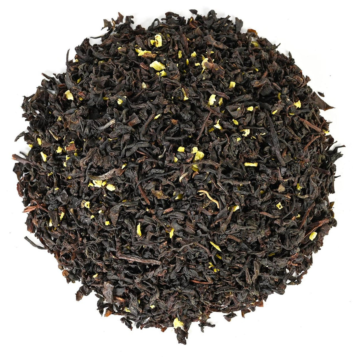 Close-up of black tea leaves on a white background