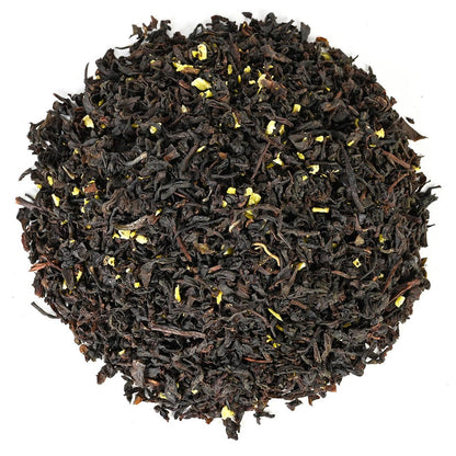 Close-up of black tea leaves on a white background