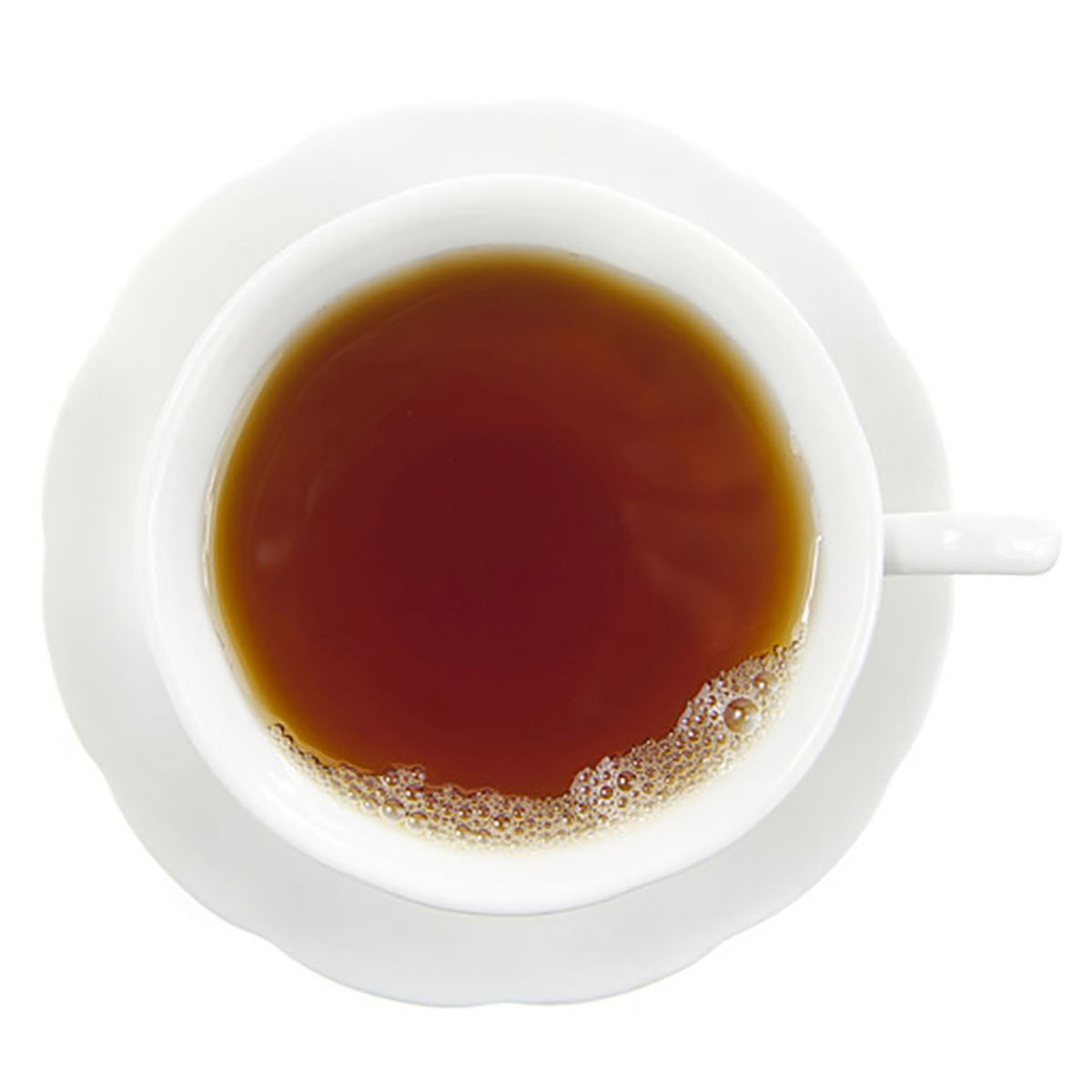 White cup filled with dark hot tea on a white background