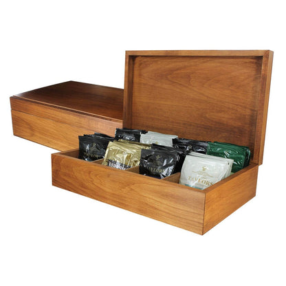 A wooden tea chest open to display various colored tea bags organized in compartments.